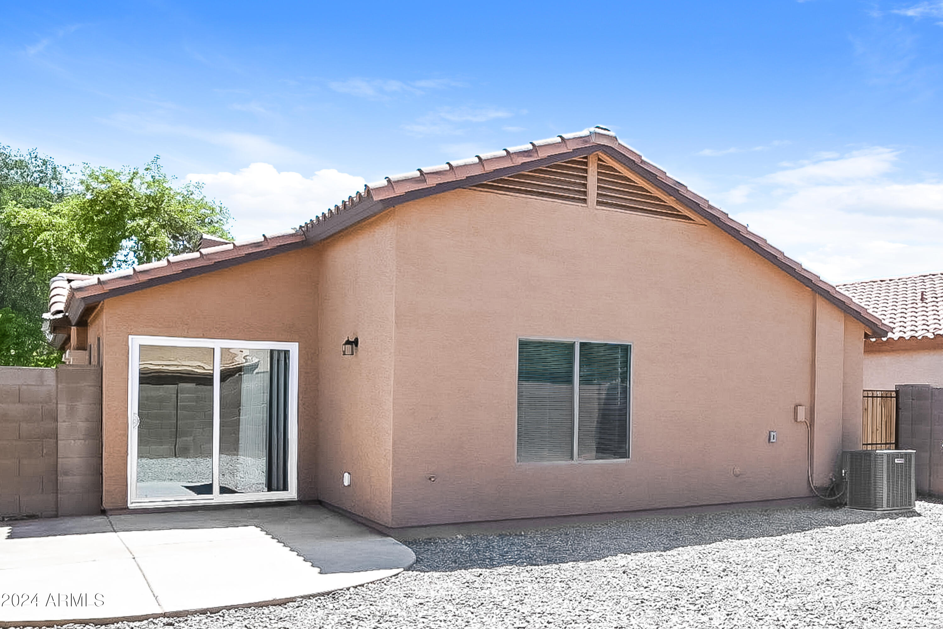41402 Hopper Drive Maricopa, AZ 85138 - Photo 15 of 16 a view of a house with a backyard