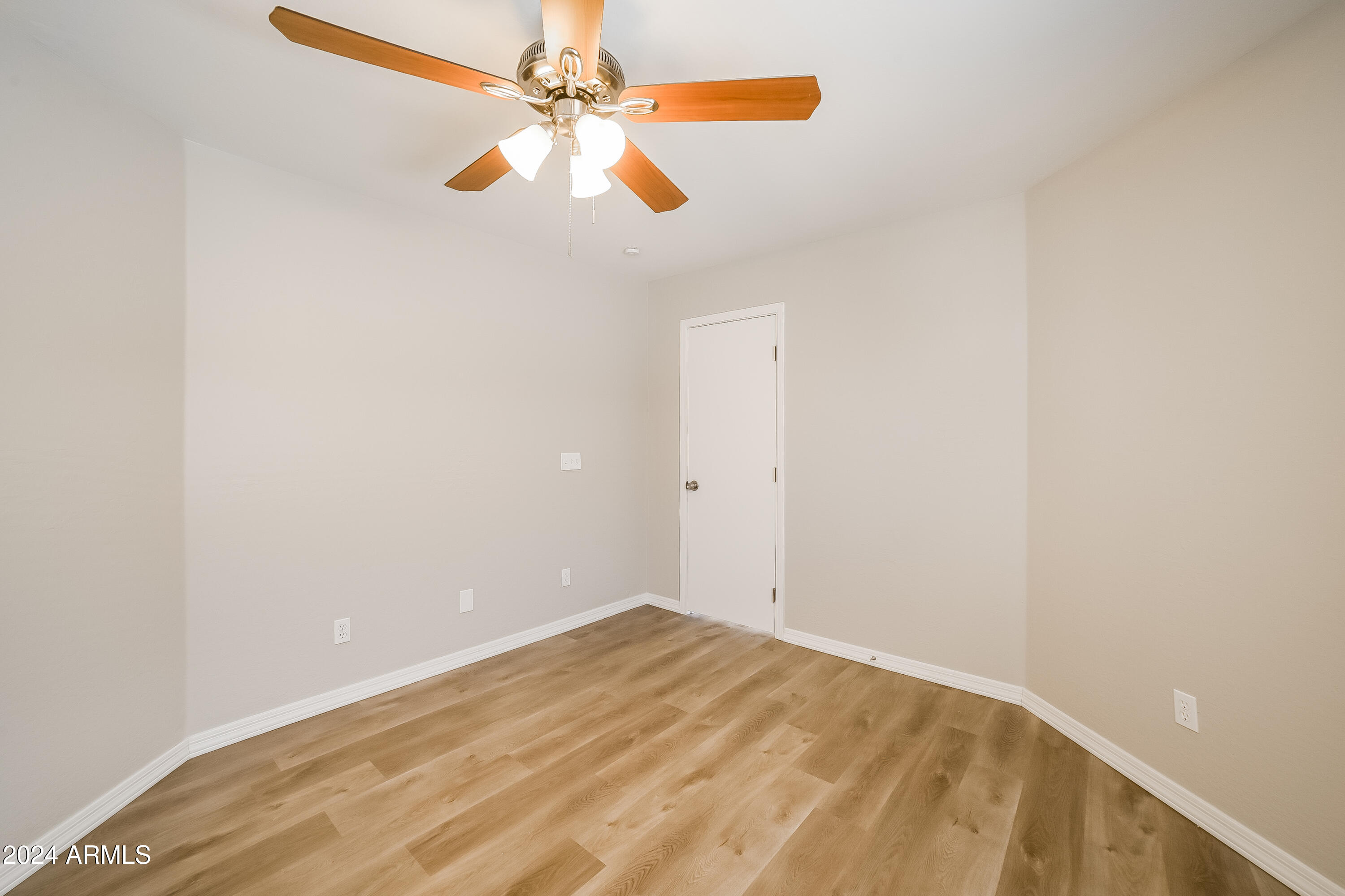 41402 Hopper Drive Maricopa, AZ 85138 - Photo 8 of 16 an empty room with a fan and a fan