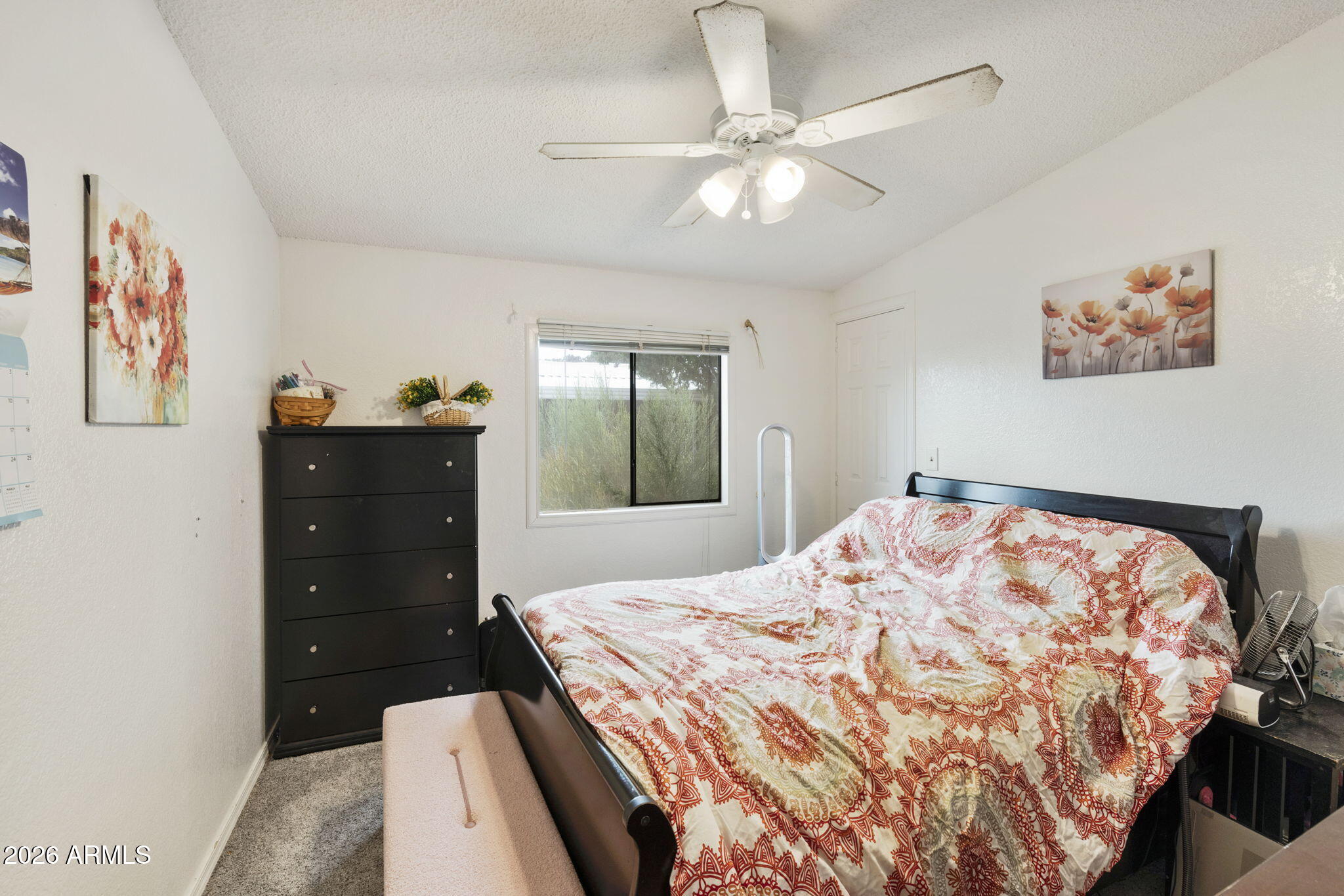 456 South 83rd Way Mesa, AZ 85208 - Photo 11 of 40 a bedroom with a bed and a dresser