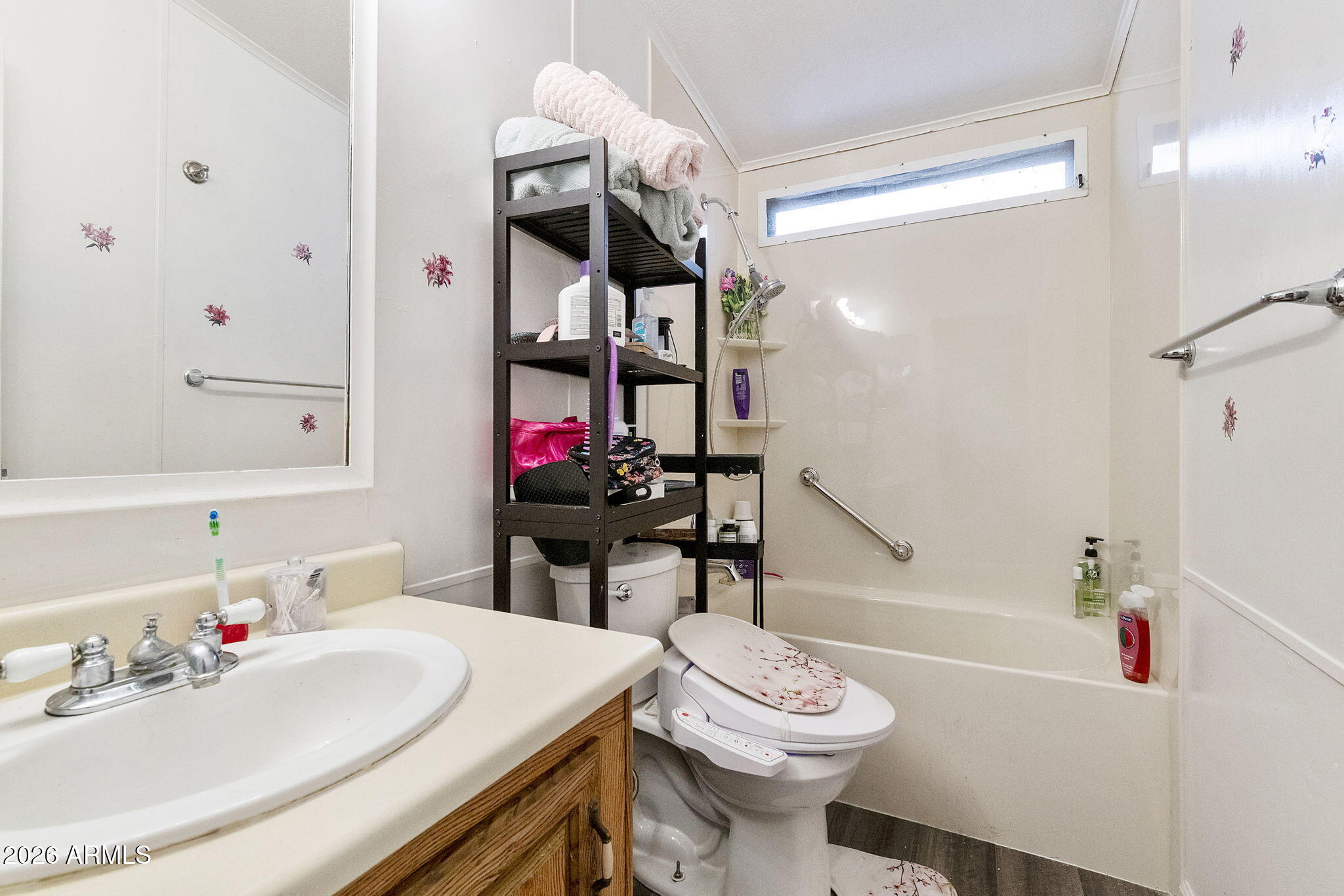 456 South 83rd Way Mesa, AZ 85208 - Photo 16 of 40 a bathroom with a sink a toilet and shower