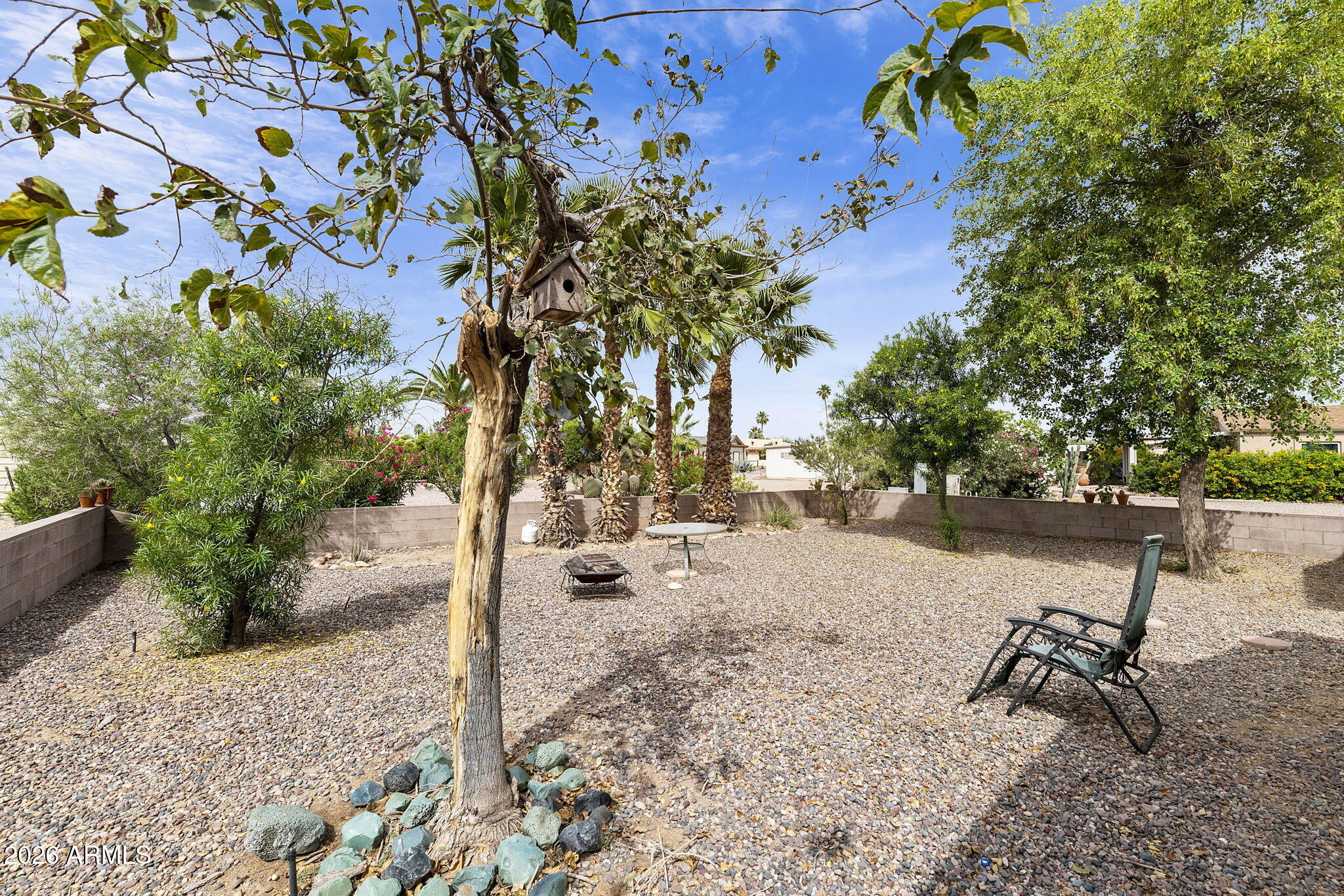 456 South 83rd Way Mesa, AZ 85208 - Photo 23 of 40 a wooden bench with trees in the background