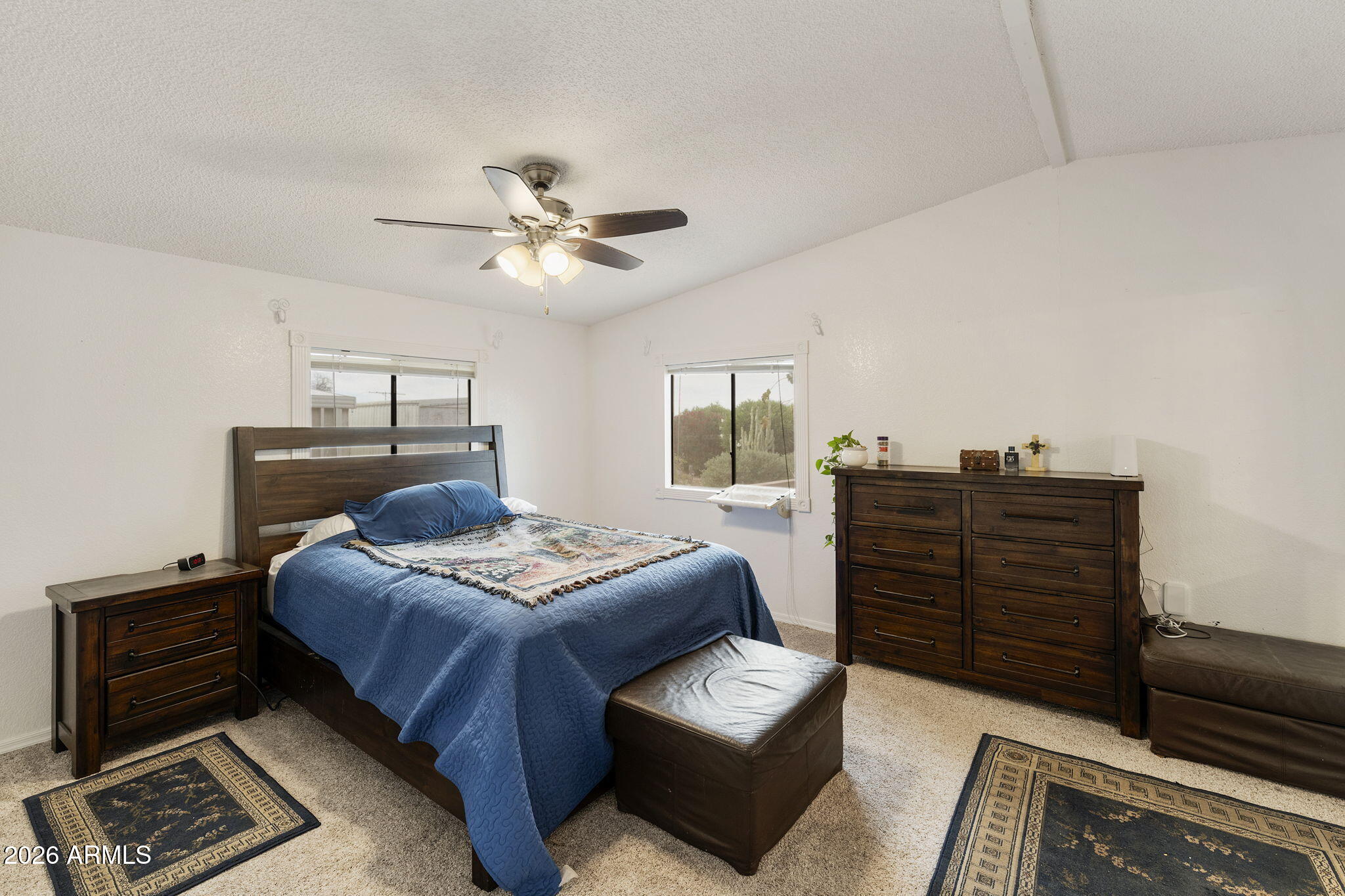 456 South 83rd Way Mesa, AZ 85208 - Photo 9 of 40 a bedroom with a bed and a chandelier