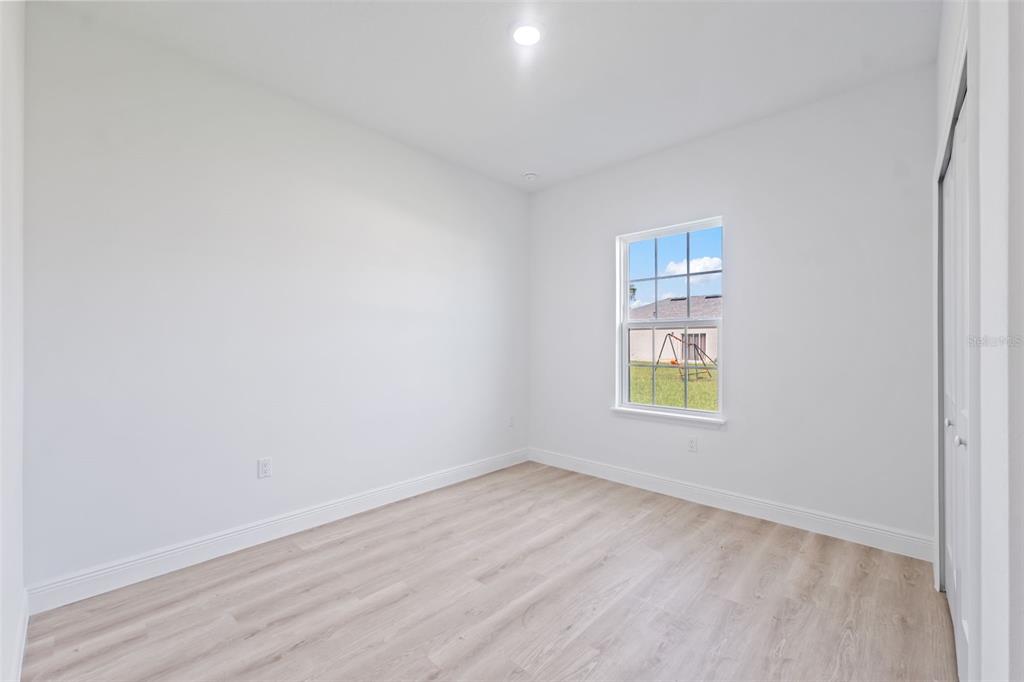 3479 Southwest 137th Loop Ocala, FL 34473 - Photo 20 of 32 an empty room with a window