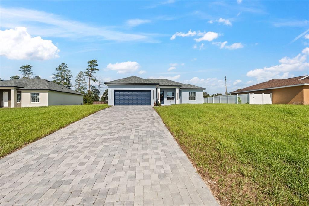 3479 Southwest 137th Loop Ocala, FL 34473 - Photo 2 of 32 a view of house with yard