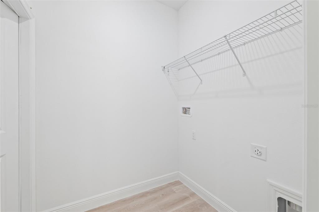 3479 Southwest 137th Loop Ocala, FL 34473 - Photo 27 of 32 a view of a room with racks on the wall