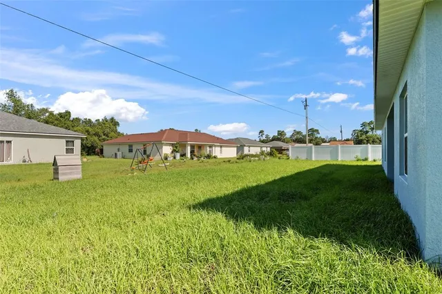 a view of a house with a big yard