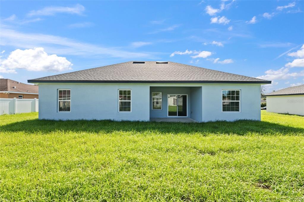 3479 Southwest 137th Loop Ocala, FL 34473 - Photo 30 of 32 a backyard of a house