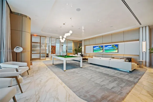 a living room with furniture a large window with kitchen view
