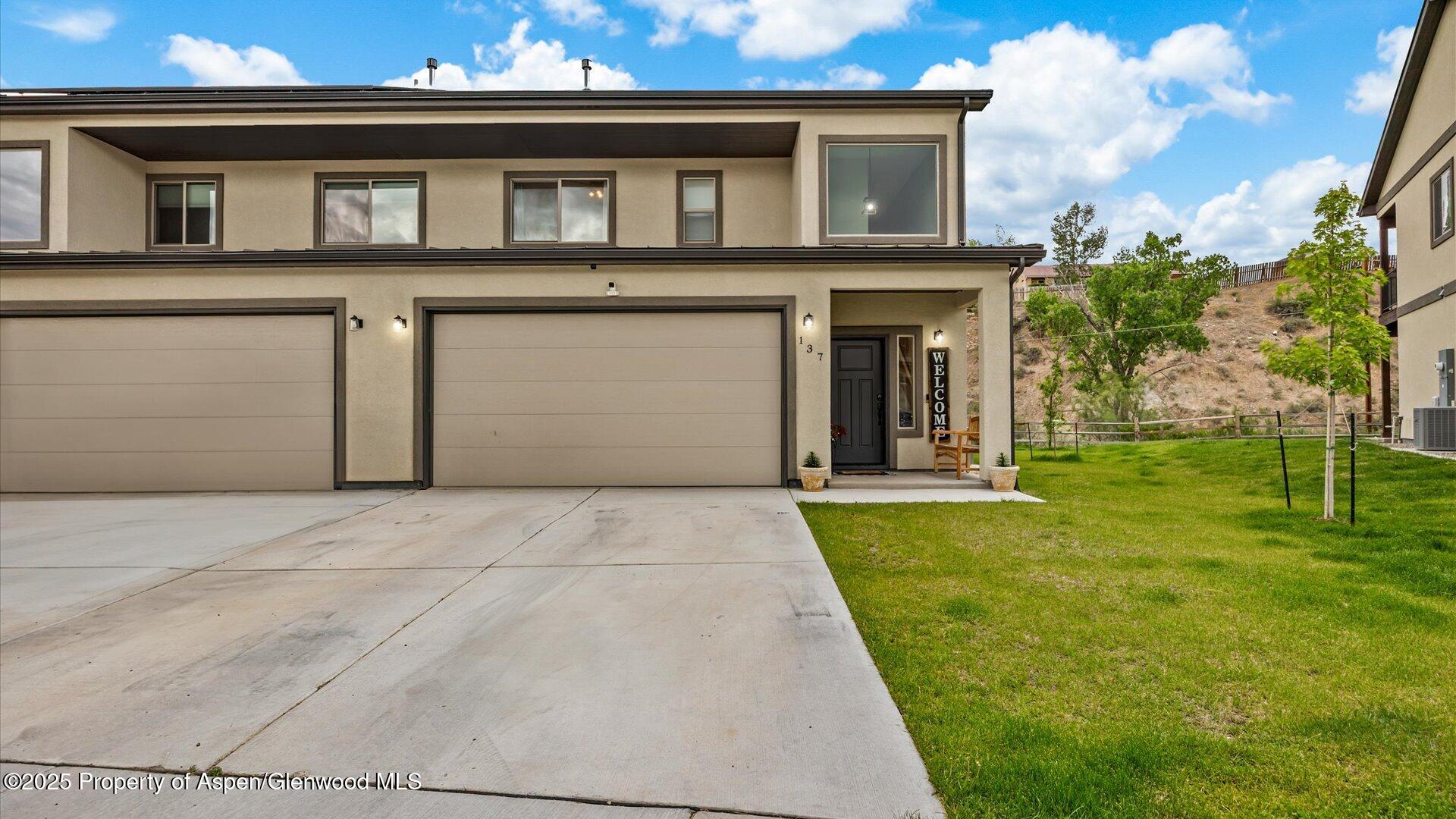 137 Willow Circle Rifle, CO 81650 - Photo 1 of 25 a front view of a house with yard