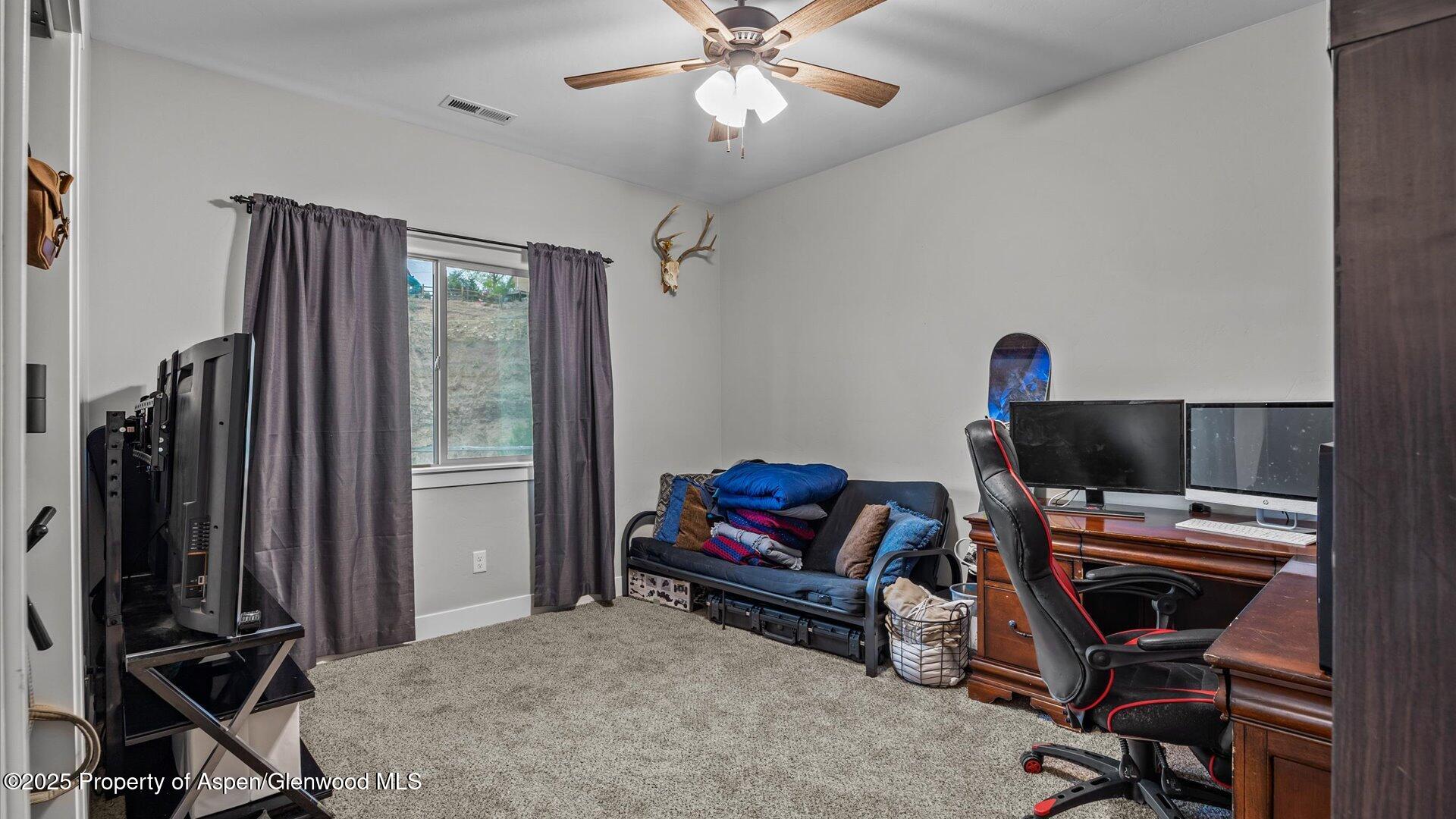 137 Willow Circle Rifle, CO 81650 - Photo 15 of 25 a livingroom with workspace and a window