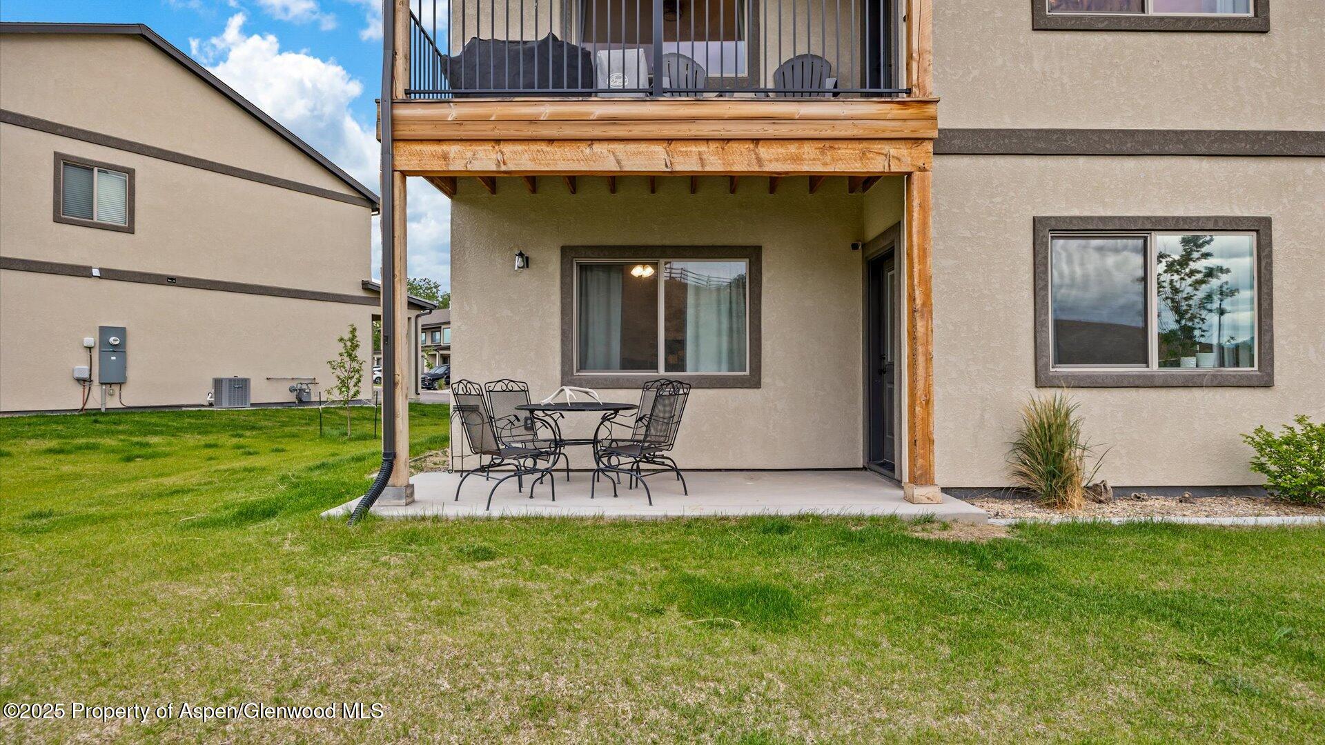 137 Willow Circle Rifle, CO 81650 - Photo 24 of 25 a view of a chair and table in backyard of the house