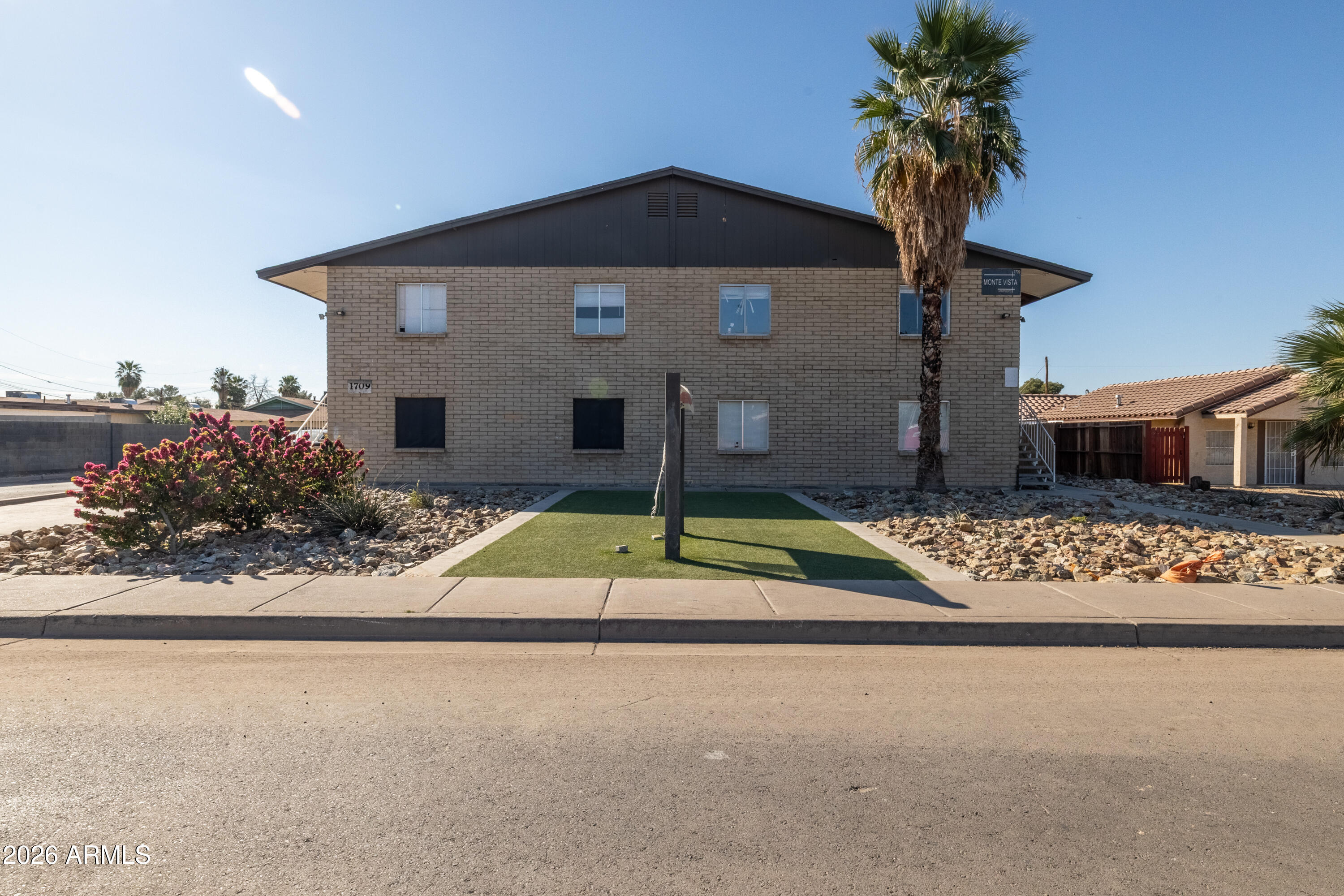 1709 West Mountain View Road Phoenix, AZ 85021 - Photo 2 of 13 a house with yard and a outdoor space