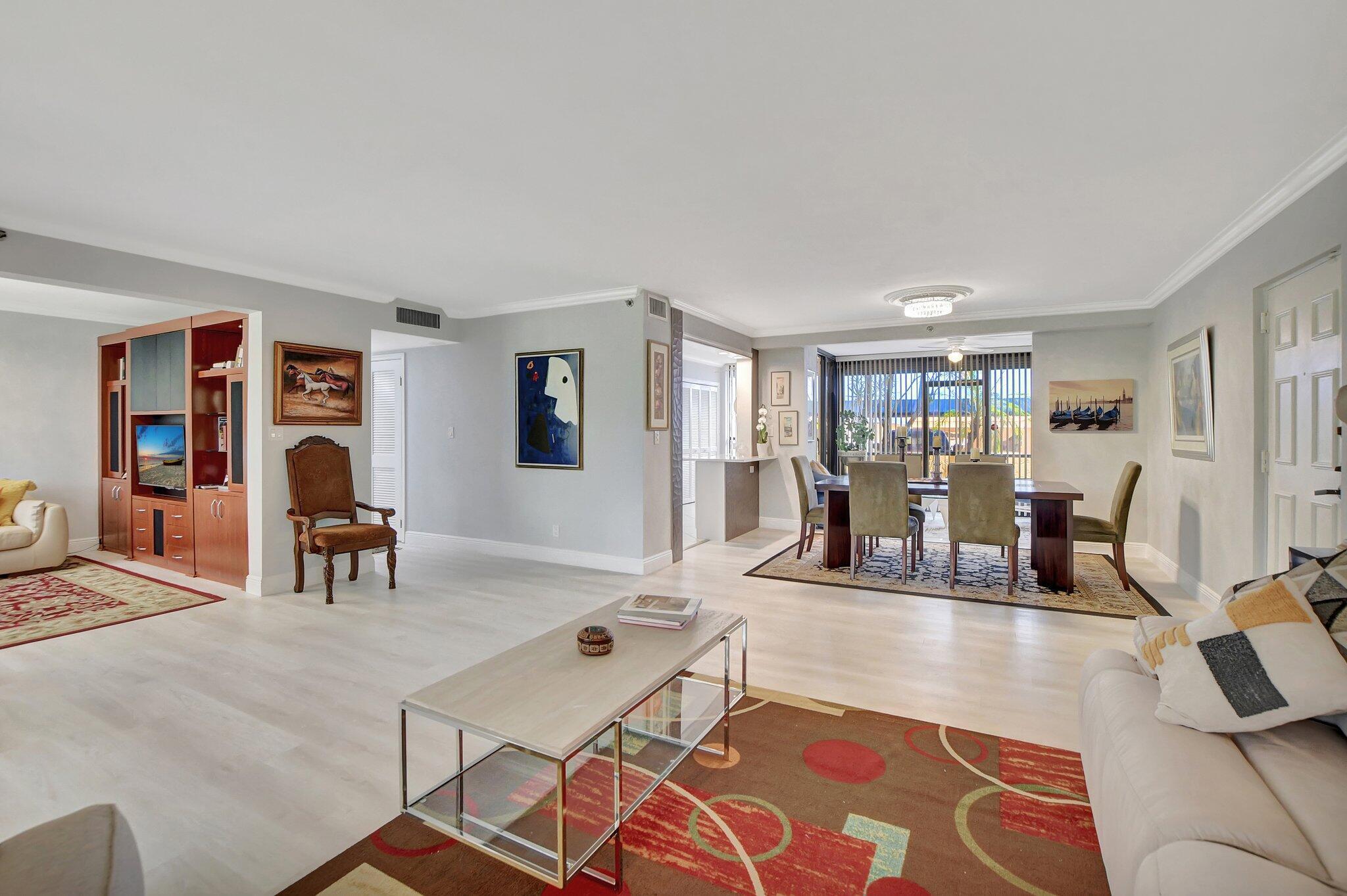 7194 Promenade Drive, Unit 102 Boca Raton, FL 33433 - Photo 7 of 56 a work room with furniture and wooden floor
