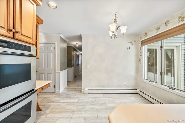 a view of an entryway with a chandelier