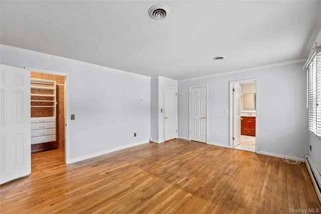 a view of a livingroom with wooden floor