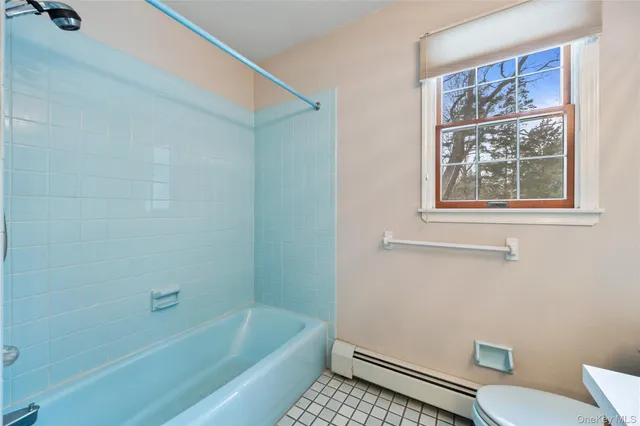 a bathroom with a sink toilet and bathtub