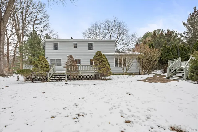 a view of a house with snow on the road