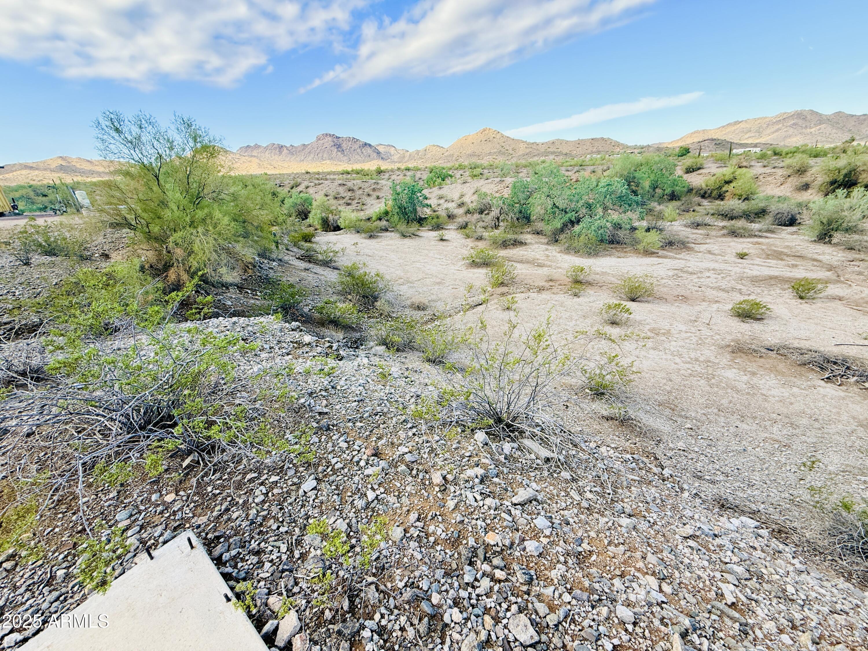 9080 South 138th Avenue Goodyear, AZ 85338 - Photo 12 of 20 a view of a road with a yard