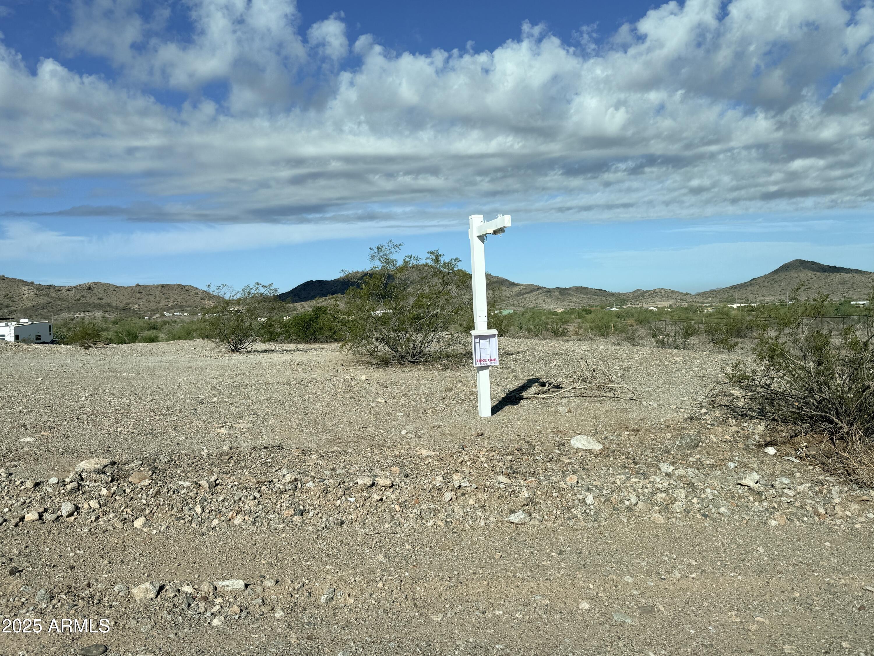 9080 South 138th Avenue Goodyear, AZ 85338 - Photo 18 of 20 a view of a lake with a mountain in the background