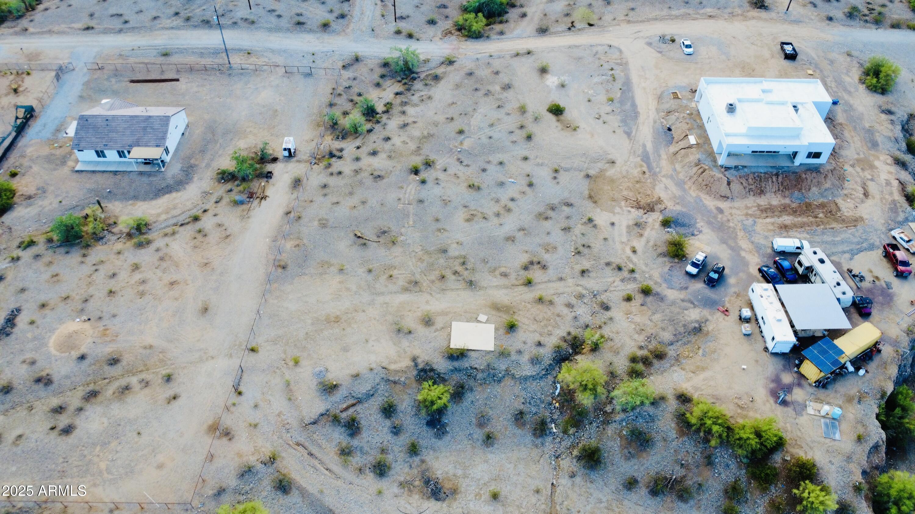 9080 South 138th Avenue Goodyear, AZ 85338 - Photo 5 of 20 an aerial view of a backyard with wooden fence