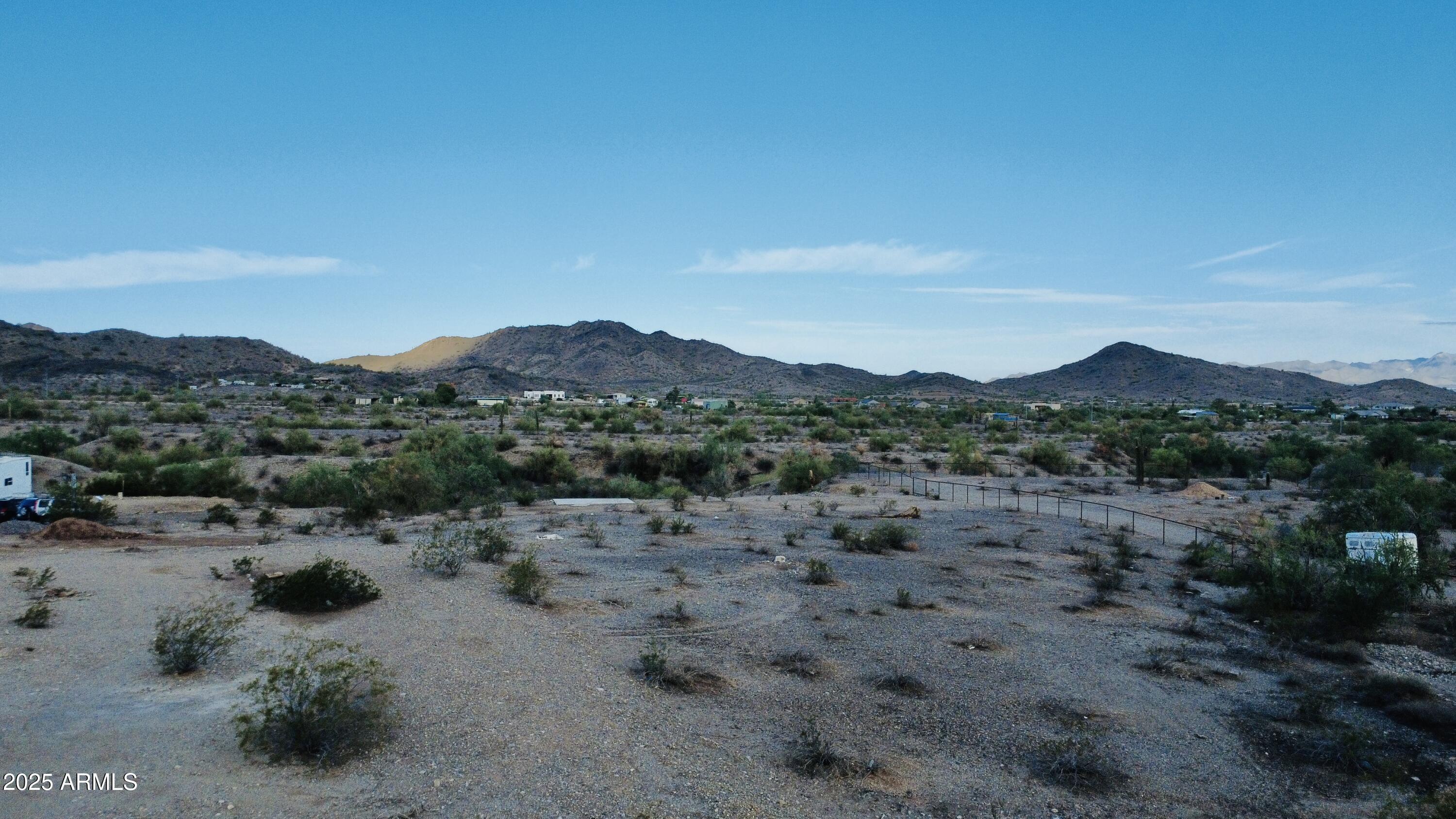 9080 South 138th Avenue Goodyear, AZ 85338 - Photo 9 of 20 a view of a road with mountains in the background