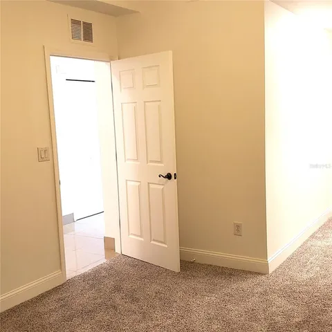 an empty room with a bathroom