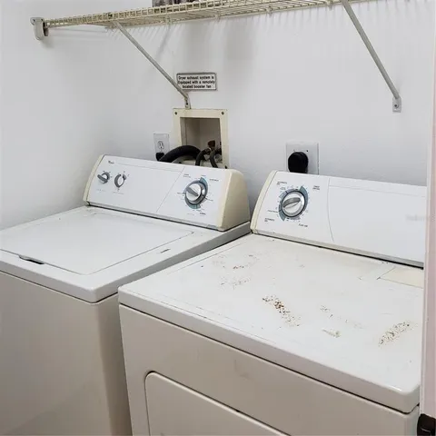 a kitchen with granite countertop a stove and a sink