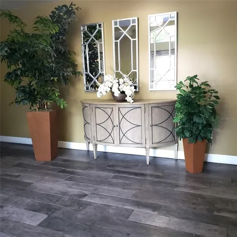 a view of a house with a window and wooden fence