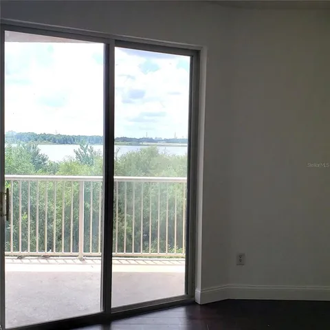 a view of a room that has a large window