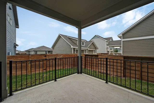 a view of houses with a street