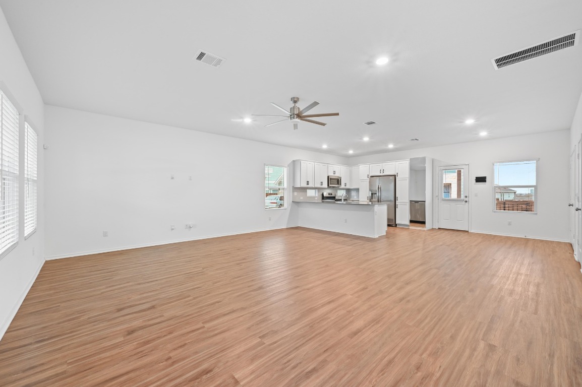 167 Rioja Kyle, TX 78640 - Photo 5 of 26 a view of kitchen and hall with wooden floor