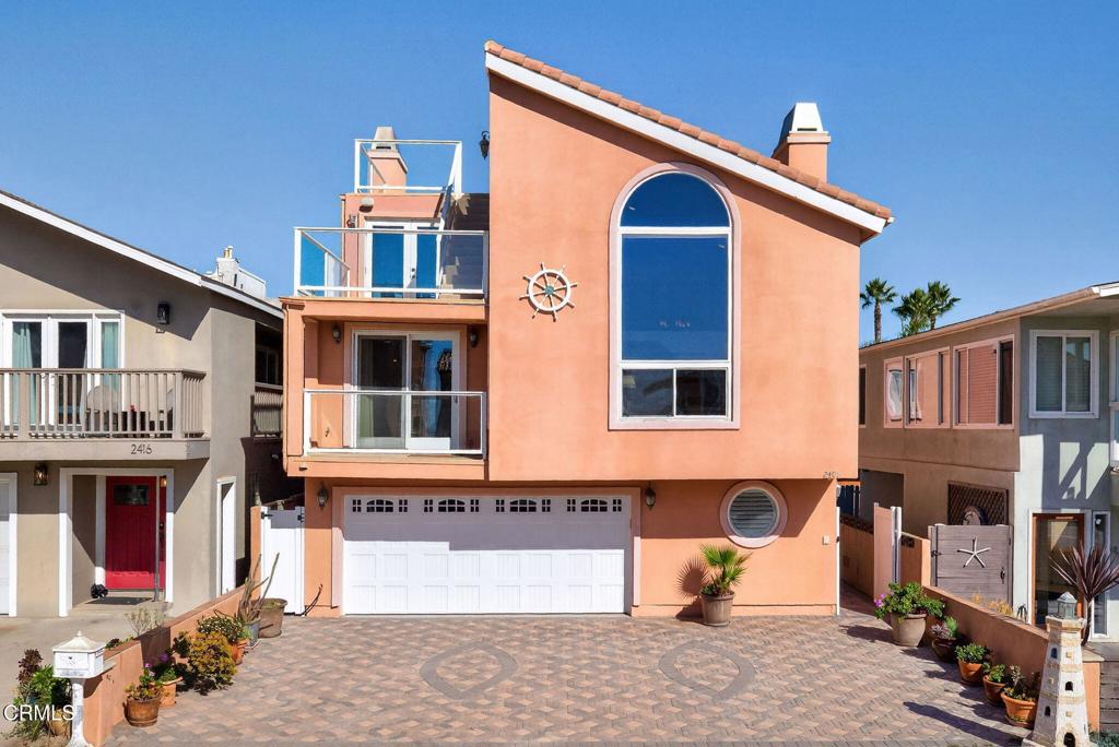 2408 Ocean Drive Oxnard, CA 93035 - Photo 4 of 58 a front view of a house with many windows
