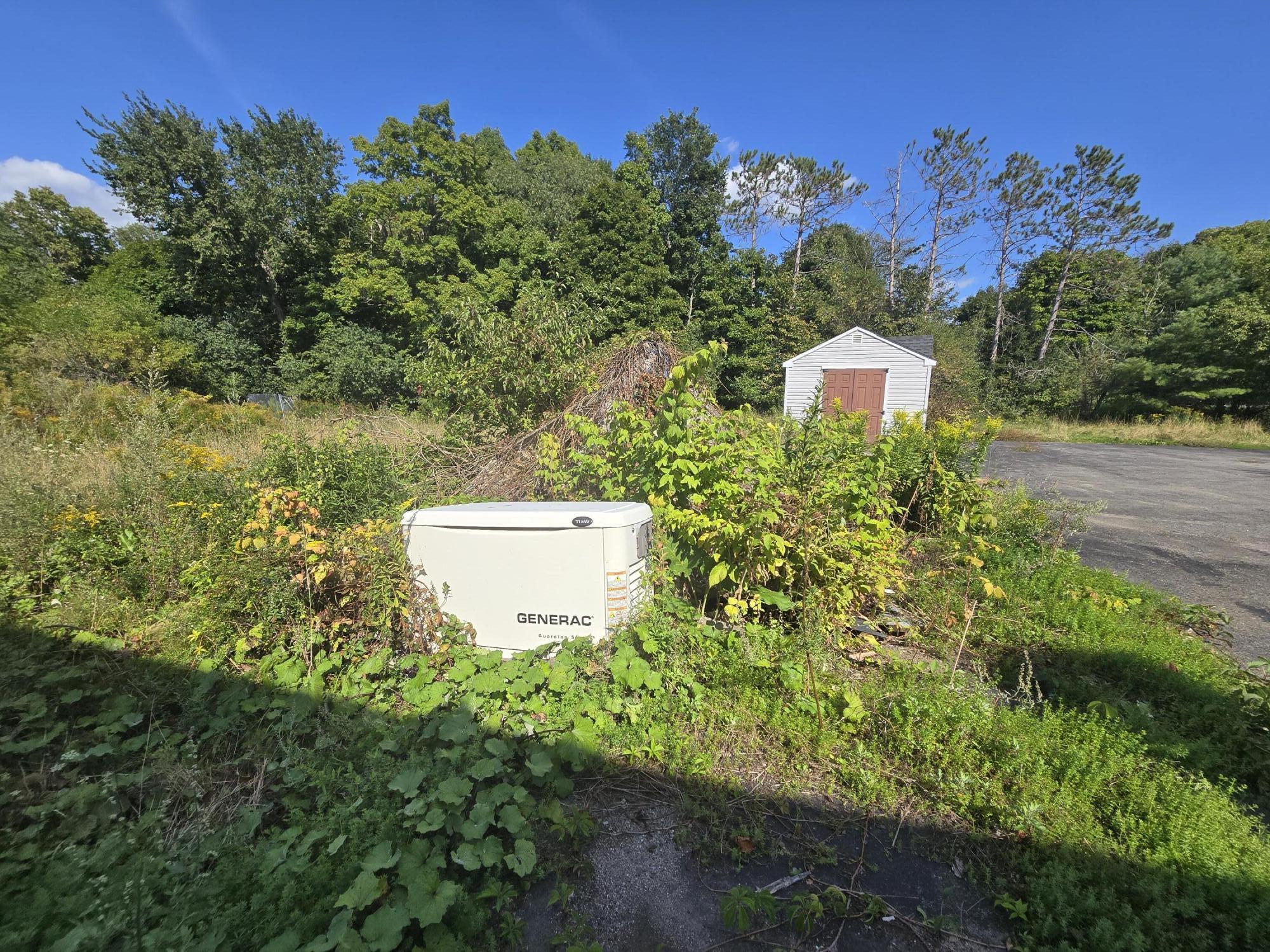 22 Fields Pond Road Orrington, ME 04474 - Photo 7 of 43 7Side View Storage Shed and Generac Gene