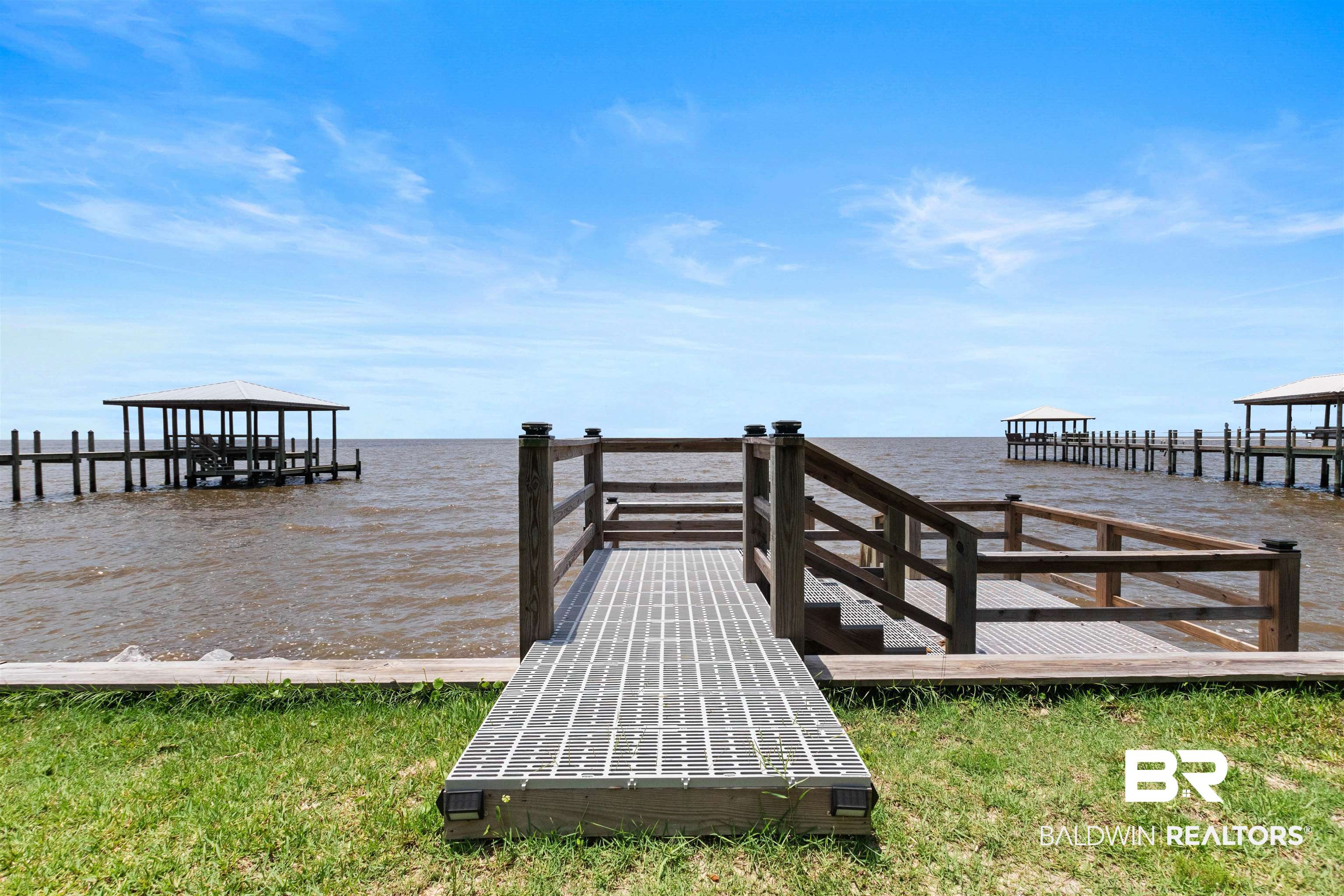 9581 South Bay Street Foley, AL 36535 - Photo 3 of 44 Waterfront access with a private pier featuring a covered boat slip and additional open slips