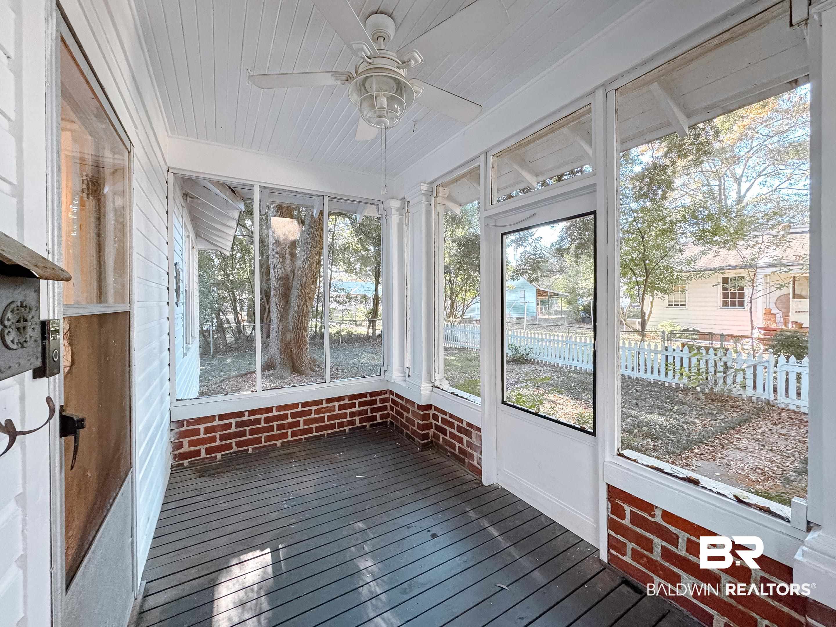 206 1st Street Mobile, AL 36611 - Photo 5 of 26 Unfurnished sunroom with a ceiling fan