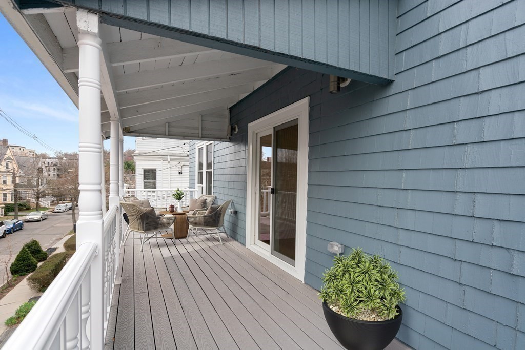 88 Coolidge Street, Unit 2 Brookline, MA 02446 - Photo 13 of 14 a balcony with furniture and wooden floor