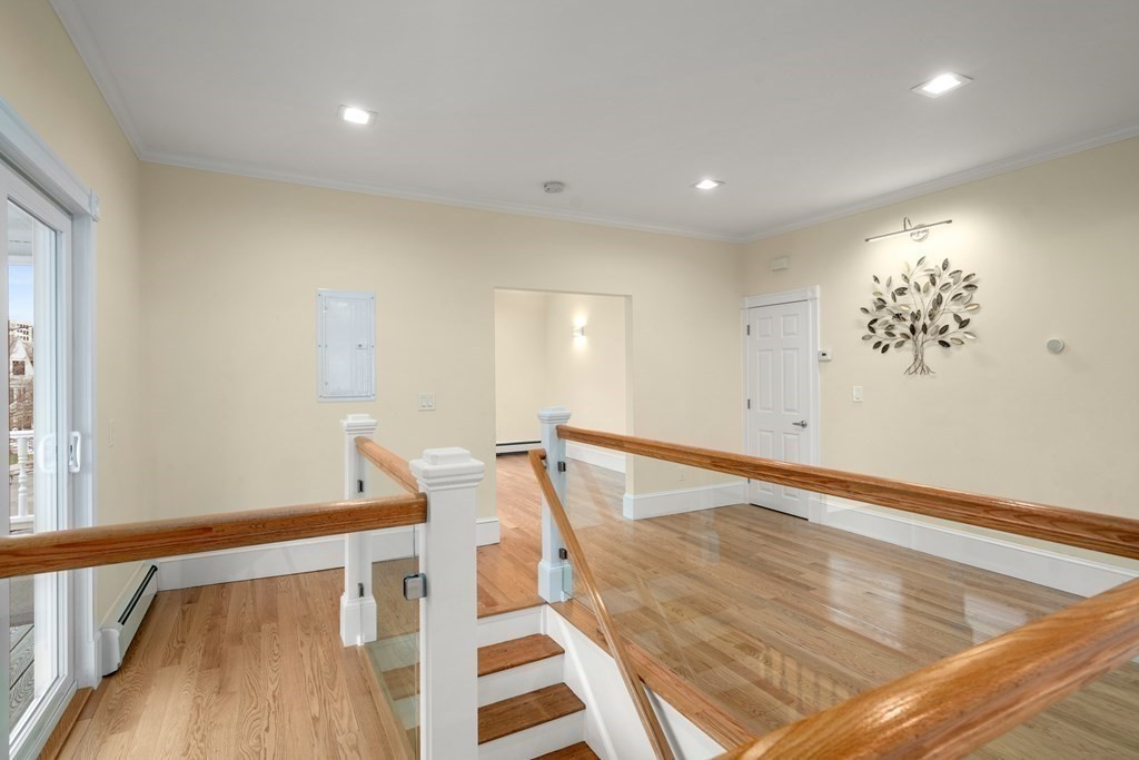 88 Coolidge Street, Unit 2 Brookline, MA 02446 - Photo 2 of 14 a view of an entryway with wooden floor
