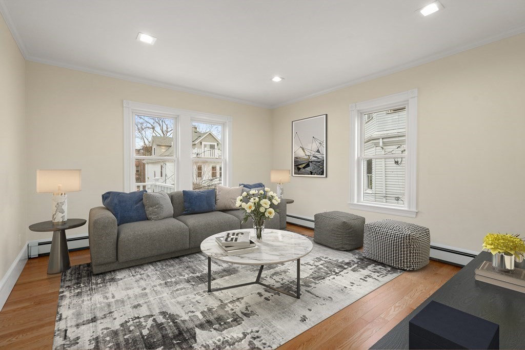 88 Coolidge Street, Unit 2 Brookline, MA 02446 - Photo 3 of 14 a living room with furniture and a table