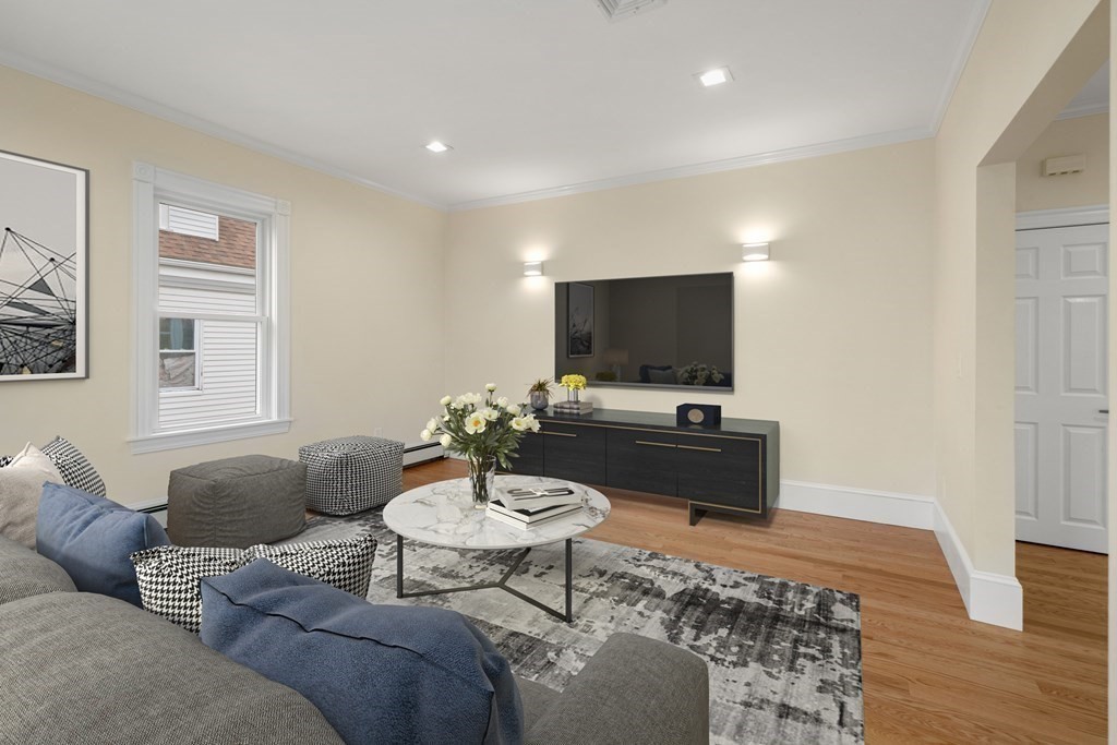 88 Coolidge Street, Unit 2 Brookline, MA 02446 - Photo 4 of 14 a living room with furniture and a flat screen tv