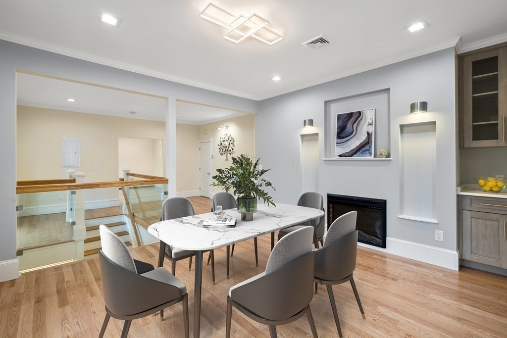 88 Coolidge Street, Unit 2 Brookline, MA 02446 - Photo 5 of 14 a dining room with furniture and wooden floor
