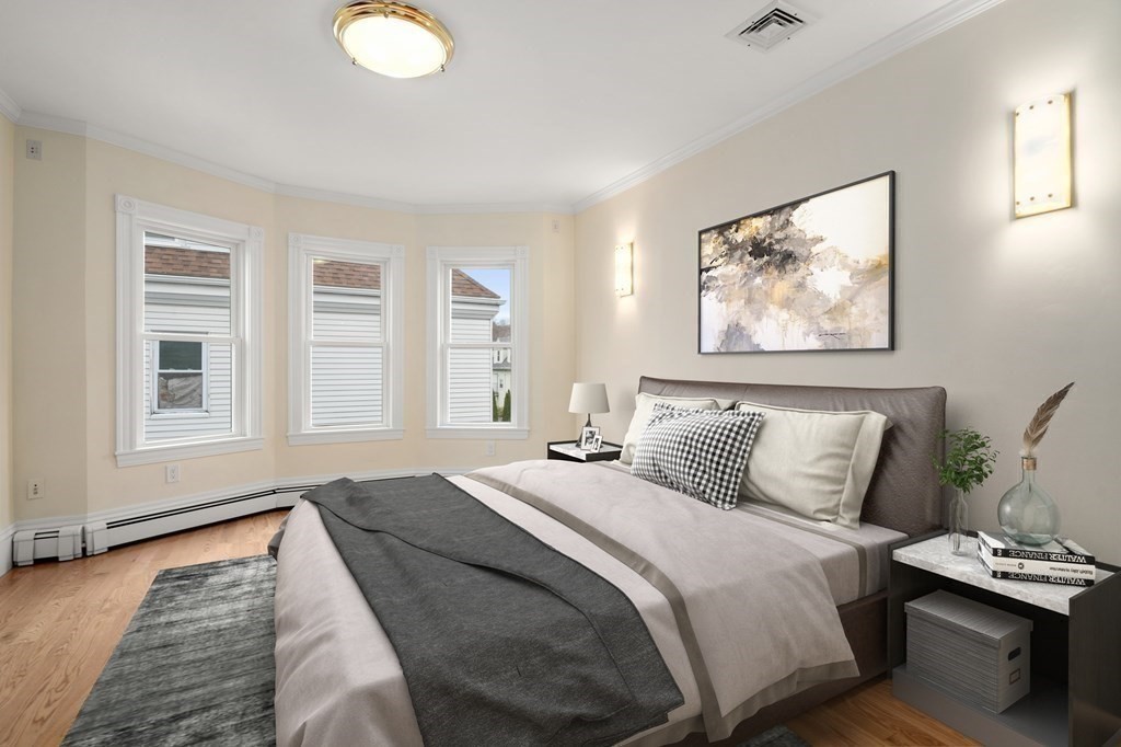 88 Coolidge Street, Unit 2 Brookline, MA 02446 - Photo 7 of 14 a bedroom with bed and a window