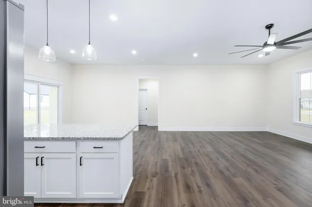 a view of a kitchen with a sink and a window