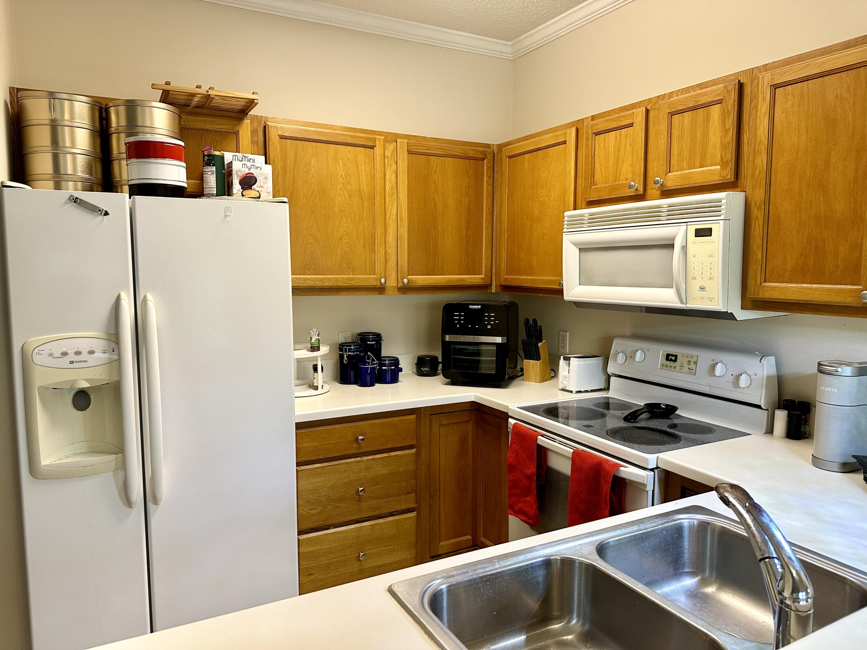 732 East Mack Bayou Drive, Unit 2 Santa Rosa Beach, FL 32459 - Photo 13 of 43 a kitchen with a refrigerator sink and microwave