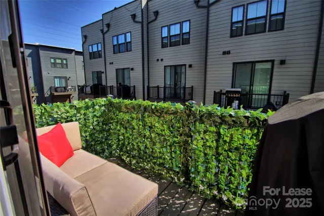 a view of a balcony with chairs
