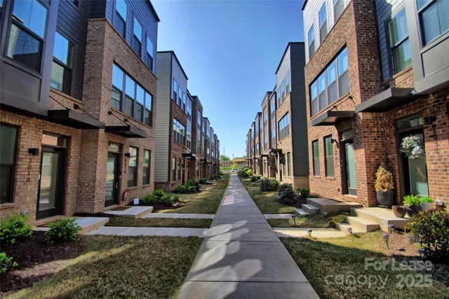 a view of a brick building with many windows