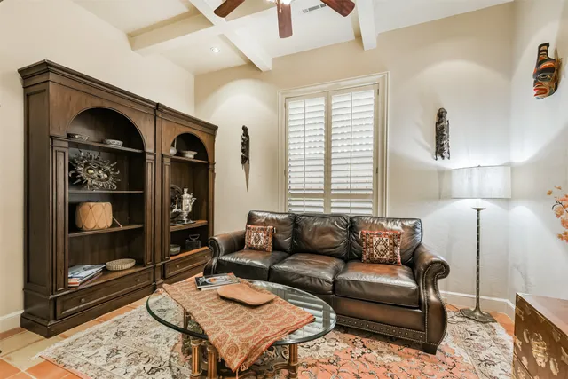 a living room with furniture a rug and a fireplace