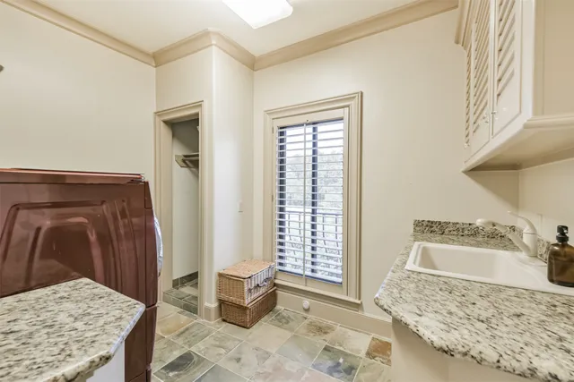 a workspace with wooden floor and a chandelier fan