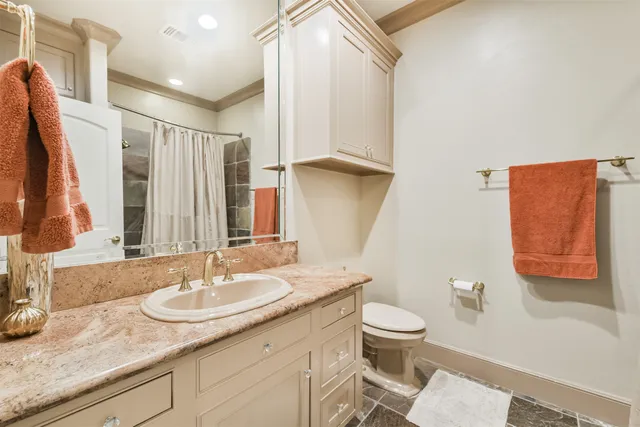 a living room with furniture ceiling fan and a rug