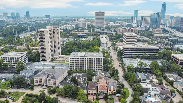 a view of a swimming pool with lawn chairs and a big yard
