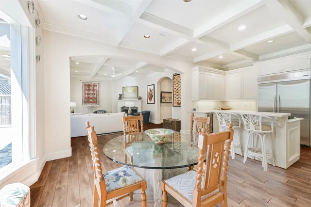 a dining room with furniture and wooden floor